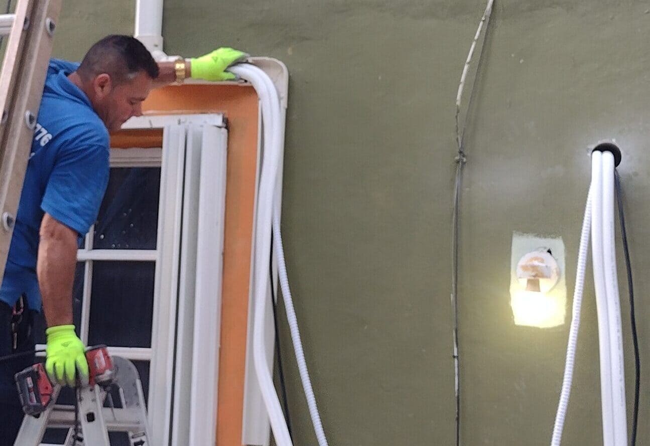 technician cleaning the ducts of an air conditioning system, improving air quality and system performance.